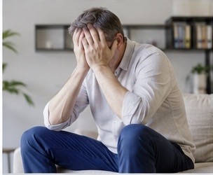 Man experiencing anxiety around urinary symptoms