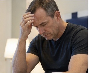 Man under stress while dealing with urinary symptoms